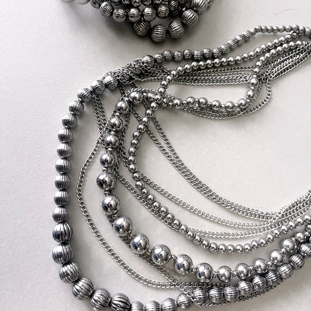 Premier Designs silver tone necklace and matching bracelet.